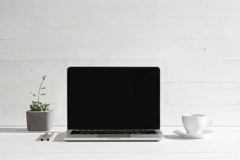 The front view of notebook and cup of coffee. Inspiration and mock-up concept Stock Photos