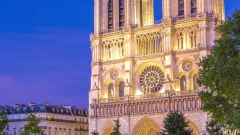 Front view of Notre Dame De Paris cathedral day to night timelapse after sunset. Stock Footage 241347465
