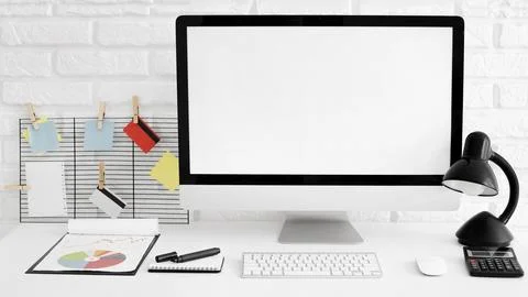 Front view office desk with computer lamp Stock Photos