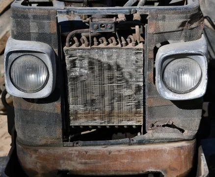 Front view of an old abandoned rusty agricultural tractor Stock Photos