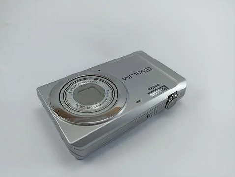 Front view of old casio digital pocket camera isolated on white background Stock Photos