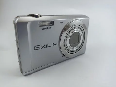 Front view of old casio digital pocket camera isolated on white background Stock Photos