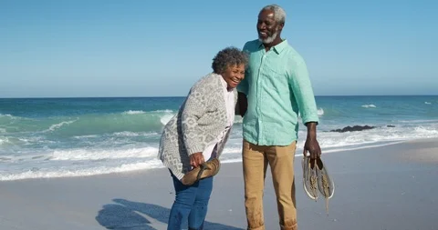 Front view old couple standing together at the beach Stock Footage 125719417