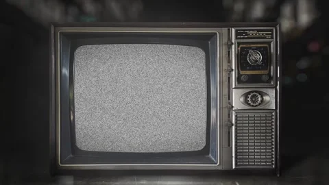 Front view of old-fashioned television with static distortion noise screen Stock Footage 310602187
