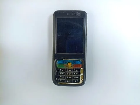 Front view of an old original Nokia N73 cell phone on a white background Stock Photos