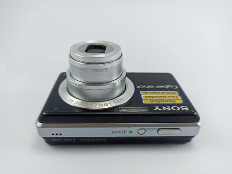 Front view of an old Sony digital pocket camera isolated on a white background Stock Photos