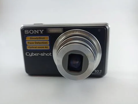 Front view of an old Sony digital pocket camera isolated on a white background Stock Photos