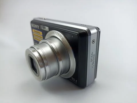 Front view of an old Sony digital pocket camera isolated on a white background Stock Photos