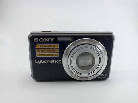 Front view of an old Sony digital pocket camera isolated on a white background Stock Photos