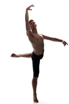Front view, one young man arms hand raised up, ballet dancer, standing on one Stock Photos