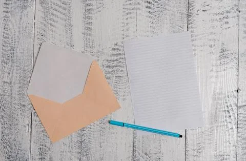 Front view open colored rectangular envelope blank sheet paper ballpoint lying 스톡 사진