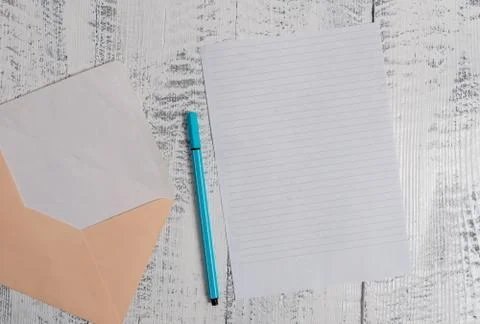 Front view open colored rectangular envelope blank sheet paper ballpoint lying Stockfoto's