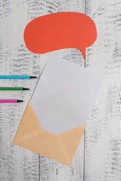 Front view open envelop speech bubble paper sheet ballpoints lying wooden old Stock Photos