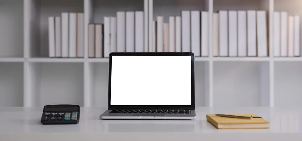 Front view of an open laptop computer with a blank white screen displayed on a Stock Photos
