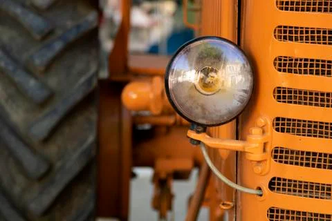 Front view of an orange tractor Stock Photos