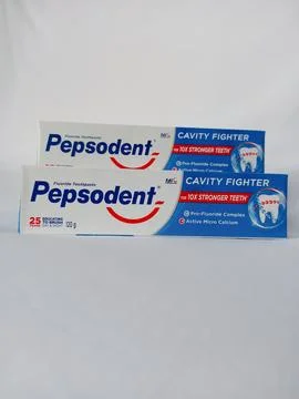 Front view of original Pepsodent toothpaste on white background. Stock Photos