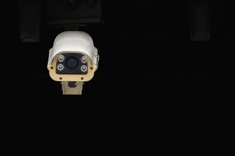 Front view of the outdoor type cctv surveillance security camera in dark back Stock Photos