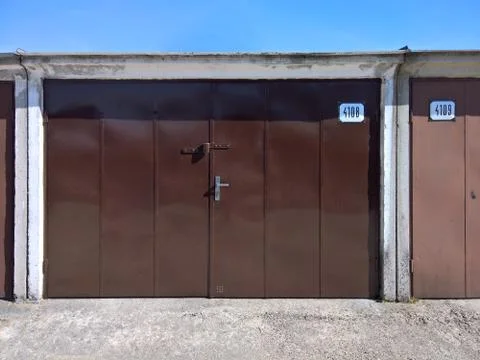 Front view of  a outside garages in a raw Stock Photos