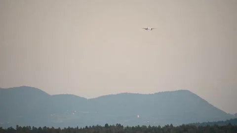 Front view of passenger airplane landing at International Ljubljana Airport Stock Footage 165563396