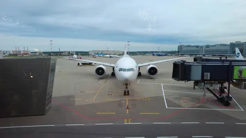 Front view of a passenger plane in front of the terminal. Russia Stock Footage 160423839