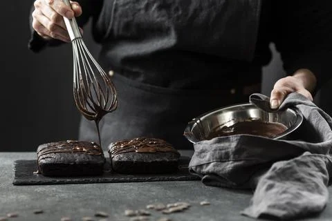 Front view pastry chef preparing cake with chocolate Stock Photos
