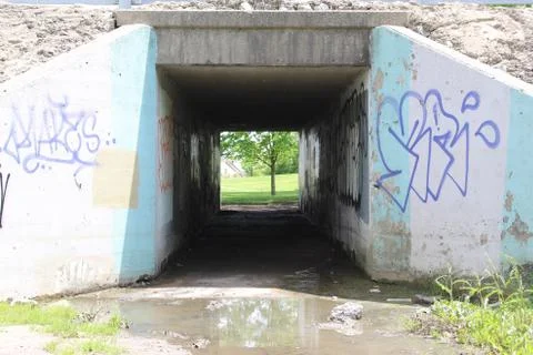 Front View Perspective of a bridge with lots of graffiti 库存照片