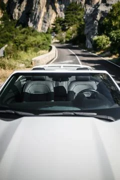 Front-view perspective through windshield on interior seats and steering wh.. Stock Photos