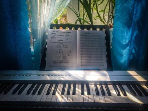 Front view of a piano with notes Stock Photos