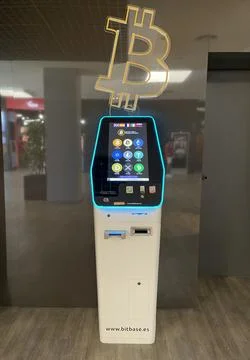 Front view picture of a Bitbase ATM in public place. Investment concept Stock Photos
