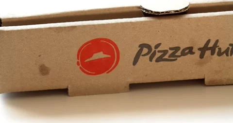 Front view of a Pizza Hut Pizza box rotating on a white background. Stock Footage 141413459