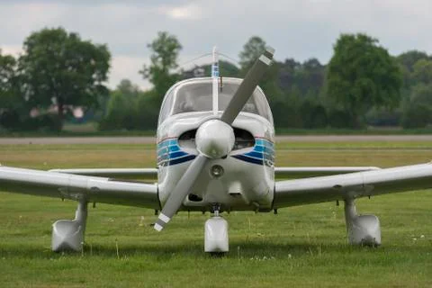 Front view of a plane on a lawn. Stock Photos
