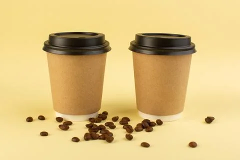A front view plastic coffee cups delivery coffee pair with brown coffee see.. 写真素材