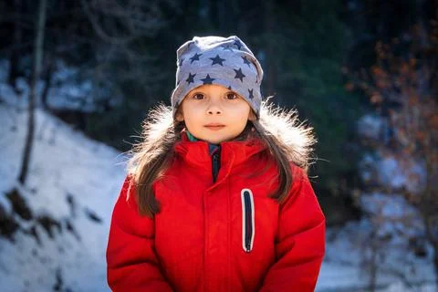 Front view portrait of 5 years old girl in winter sunny day Stock Photos