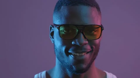Front view portrait of a young African American man turning his face to the Stock-Footage 233612857