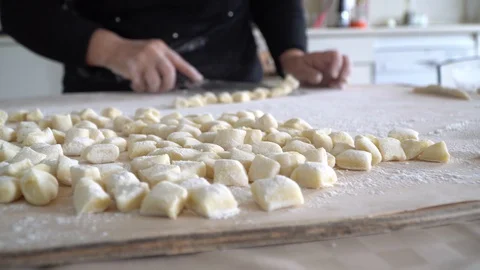 Front view of potatoes gnocchi on focus in the kitchen Stock Footage 128988185