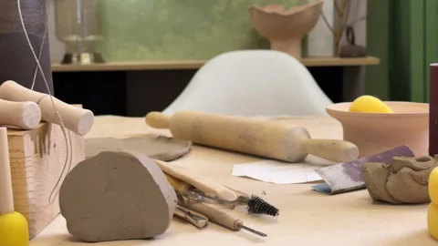 Front view of the pottery tools in the workshop against the green wall Video stock 306091157