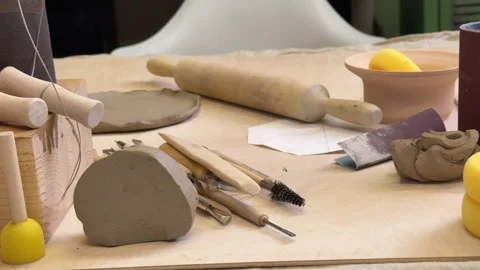 Front view of the pottery tools in the workshop against the green wall 스톡 동영상 306091267