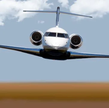 Front view of a private jet in-flight Stock Photos