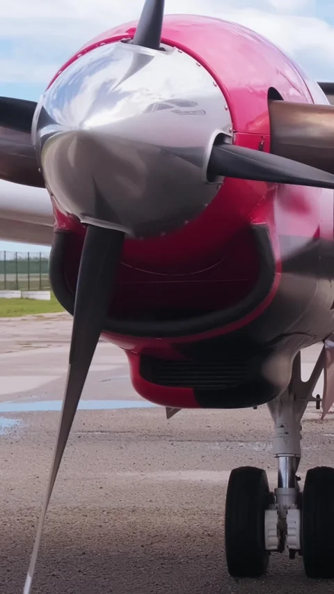 Front view of propeller engine of small general aviation airplane parked on Stock Footage 338379059