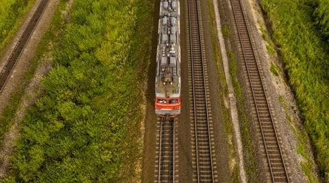 Front view of a railway train moving along the railroad tracks Stock Photos