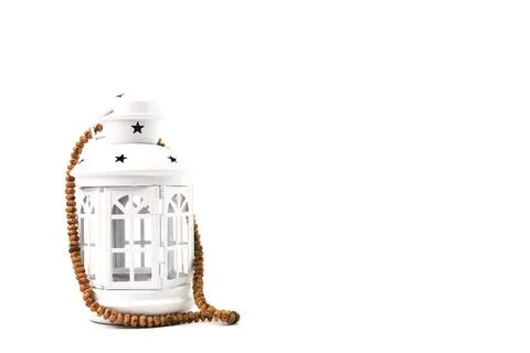 Front view of Ramadan lantern and prayer beads isolated on a white background Stock Photos