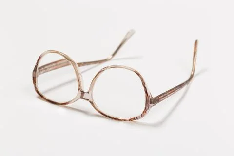 Front view of reading glasses with tortoiseshell frames on white background Stock Photos