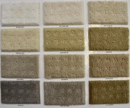 Front view of rectangle multicolored rug design samples on display at a store Stock Photos