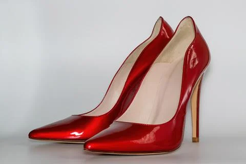 Front view of the red colored high heeled women's shoes. Stock Photos