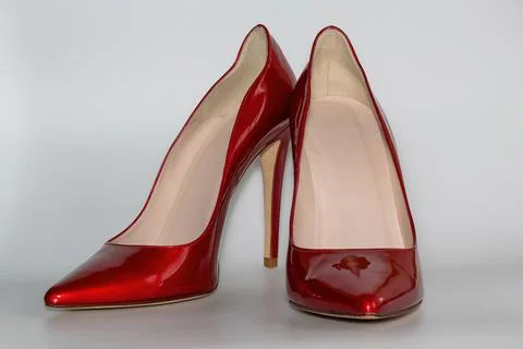 Front view of the red colored high heeled women's shoes. Stock Photos