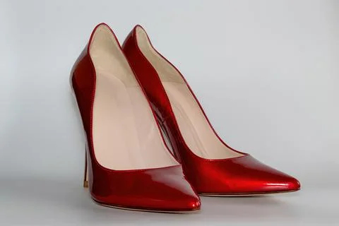 Front view of the red colored high heeled women's shoes. Stock Photos