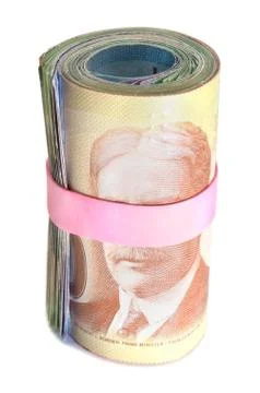 Front view of a roll of banknotes wrapped with a pink rubber band Foto stock