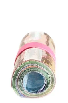 Front view of a roll of banknotes wrapped with a pink rubber band Stock Photos