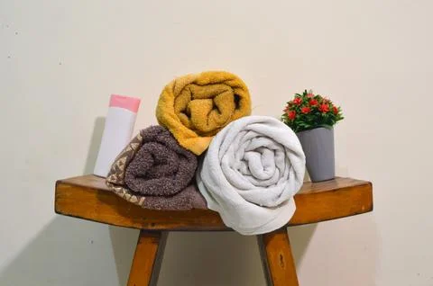 Front View of Rolled Towels and Fresh Body Care Products Stock Photos