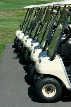 Front view of a row of golf carts Stock Photos